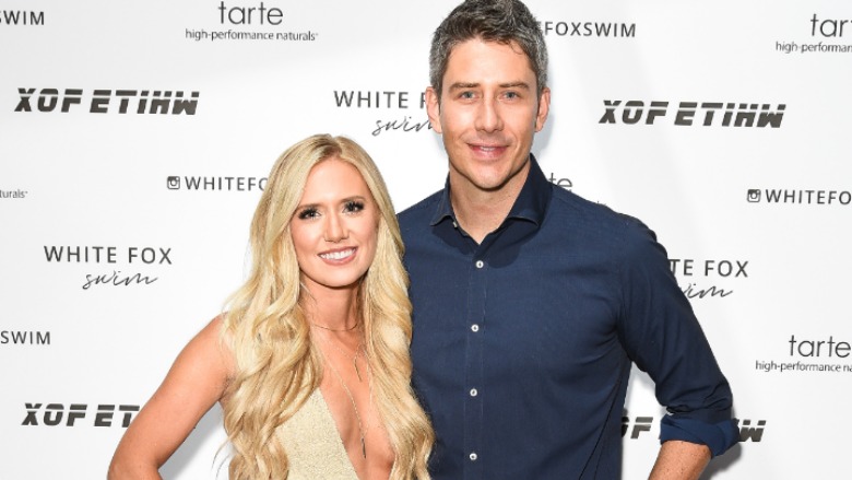 Arie and Lauren Luyendyk posing on the red carpet.