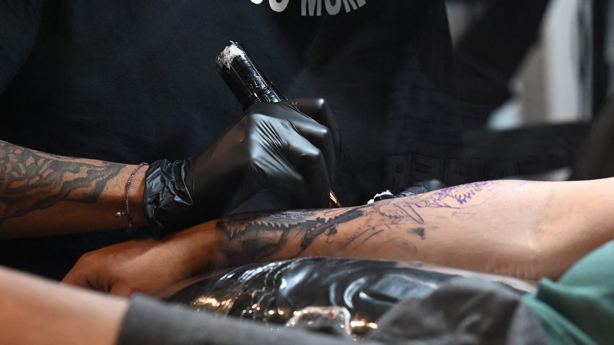 A tattoo artist at work