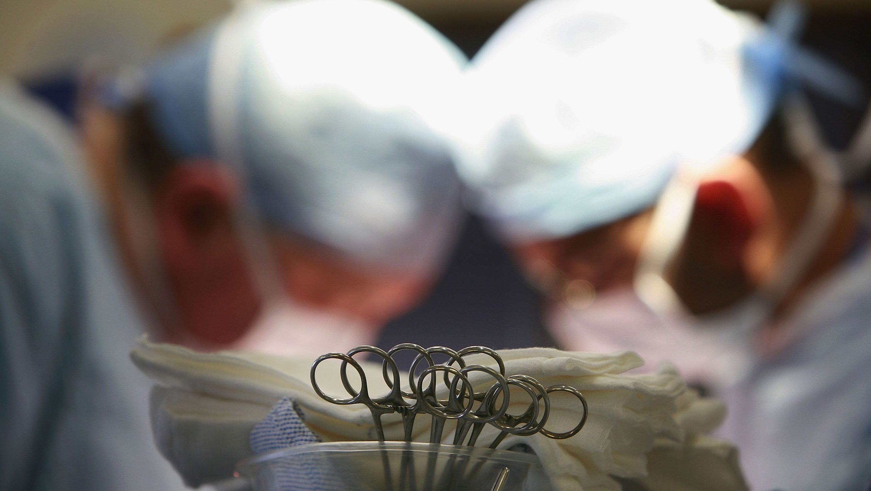 Surgeons conduct an operation.
