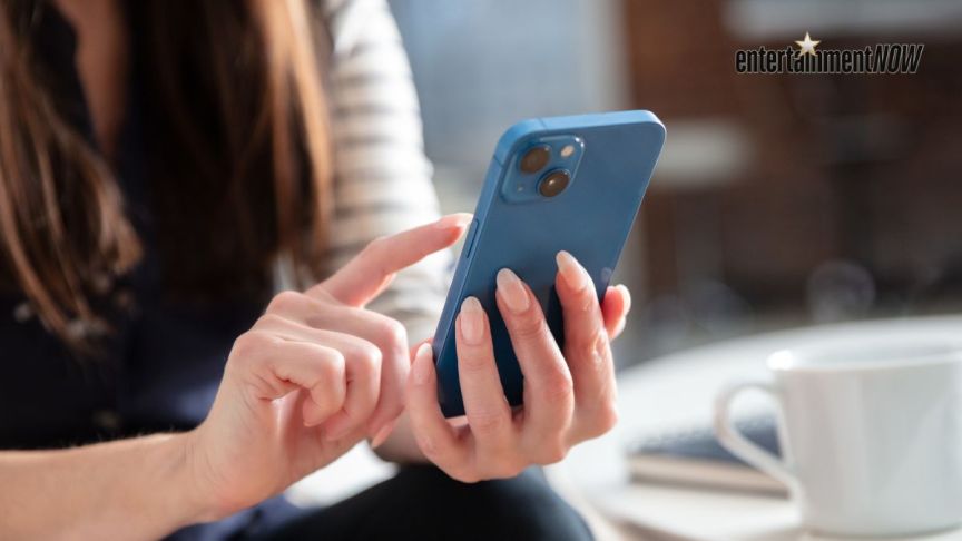 A woman texts on a phone.