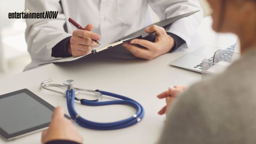 A doctor speaking to a patient.