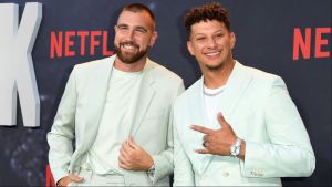 Travis Kelce and Patrick Mahomes pose on the red carpet at the Netflix premiere of Quarterback.