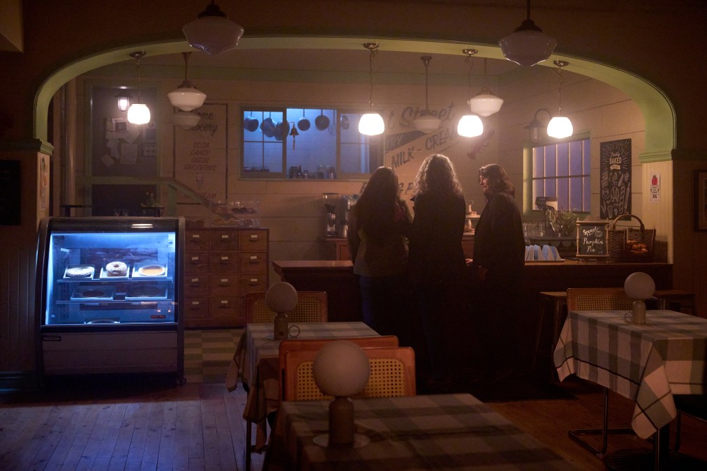 We see the backs of Alice, Del and Kat as they are at The Point talking
