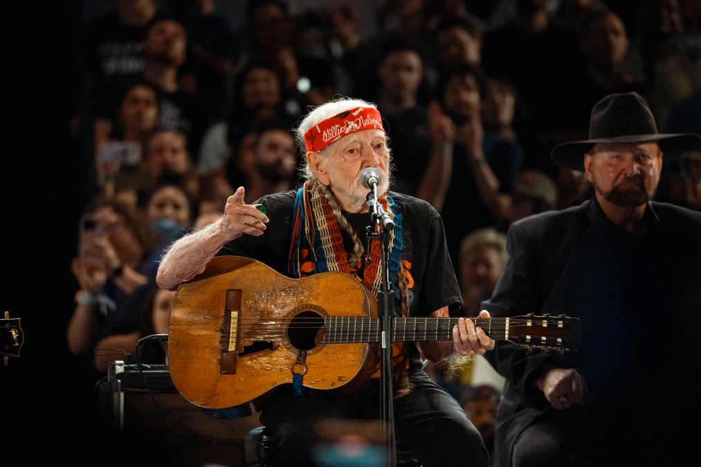 Willie Nelson playing guitar