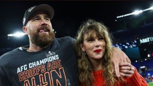 Travis Kelce #87 of the Kansas City Chiefs (L) celebrates with Taylor Swift after defeating the Baltimore Ravens in the AFC Championship Game at M&T Bank Stadium on January 28, 2024