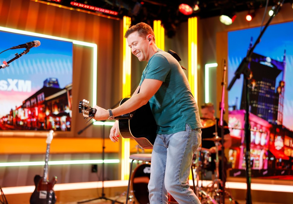 Scotty McCreery playing guitar