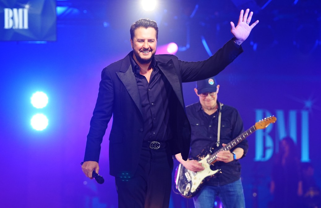 Luke Bryan waving on stage