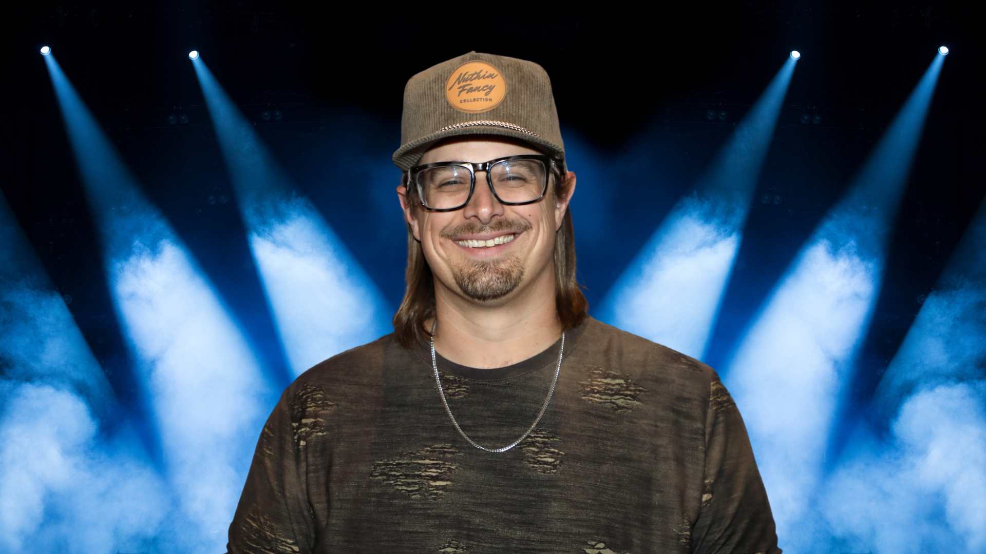 HARDY smiling on a stage
