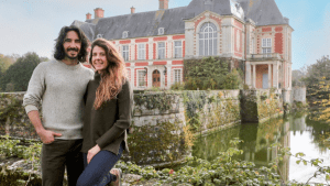 "Castle Impossible" stars posing outside of their French chateau