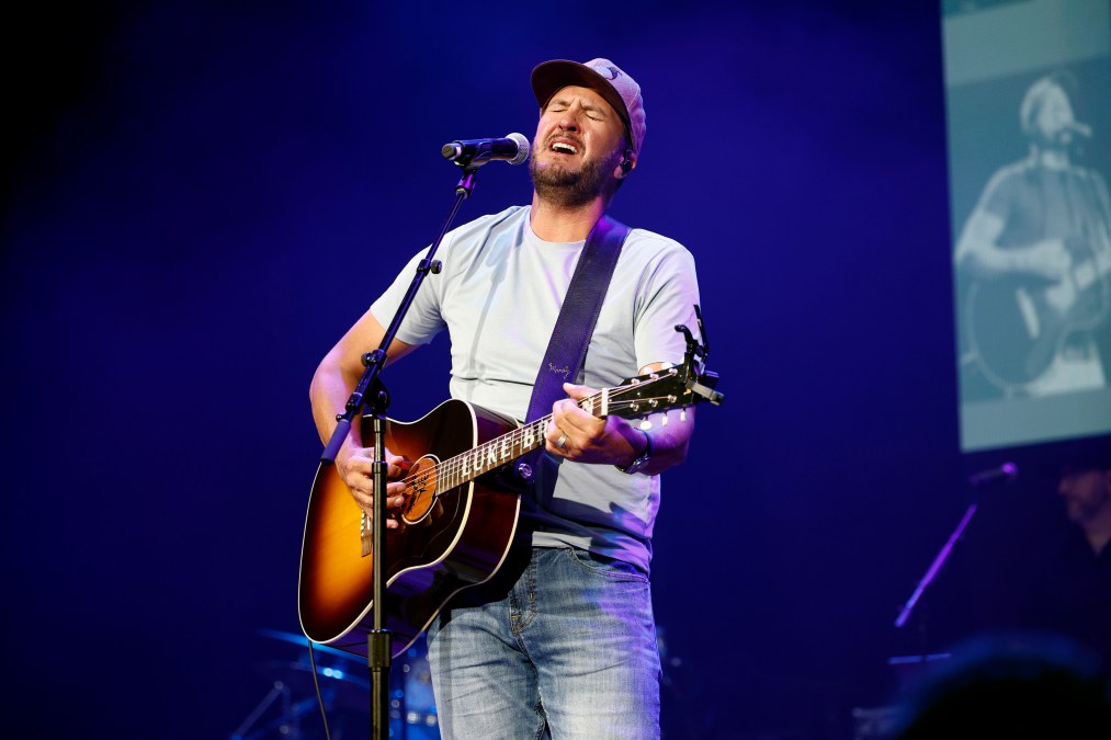 Luke Bryan singing on stage