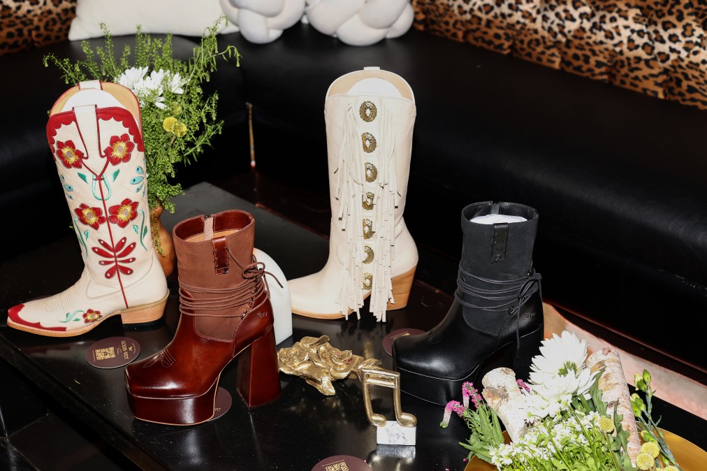 Lainey Wilson's Golden West Boots line on a table
