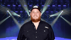 Luke Combs posing on stage