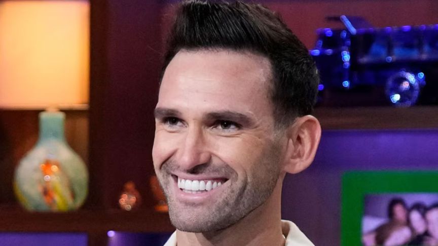 Summer House star Carl Radke smiles during an appearance on WWHL
