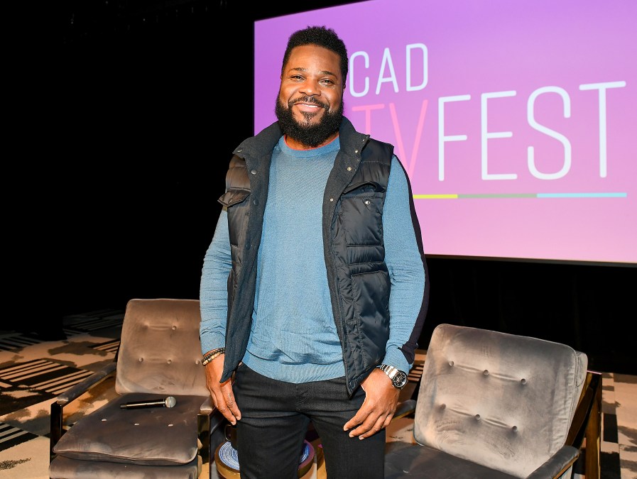 Malcolm-Jamal Warner posing for a photo