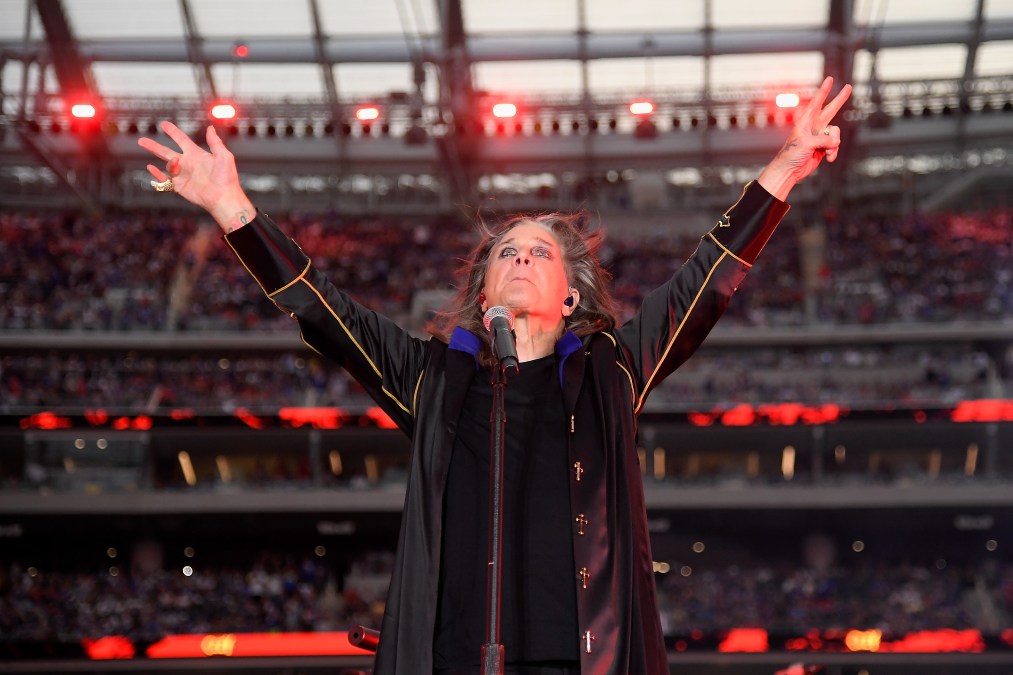 Ozzy Osbourne raising his arms