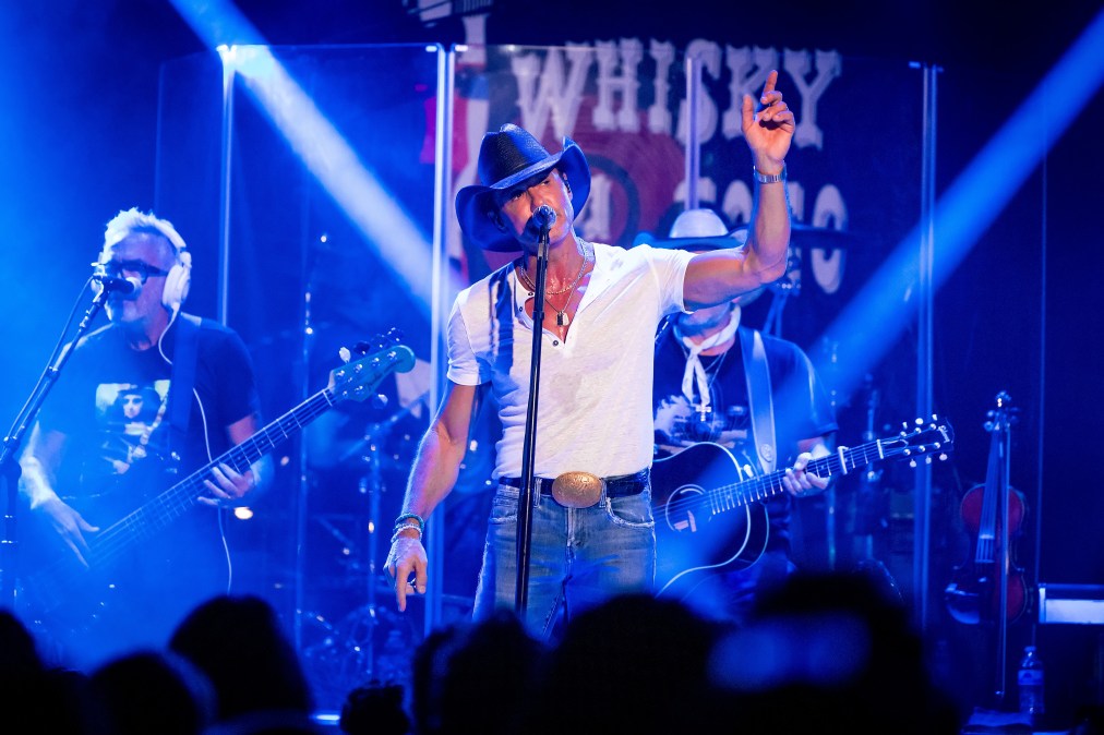 Tim McGraw singing into a microphone