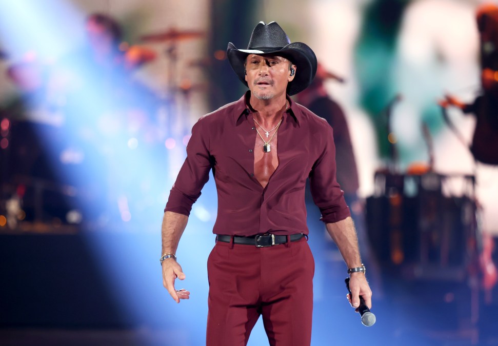 Tim McGraw performing on stage.