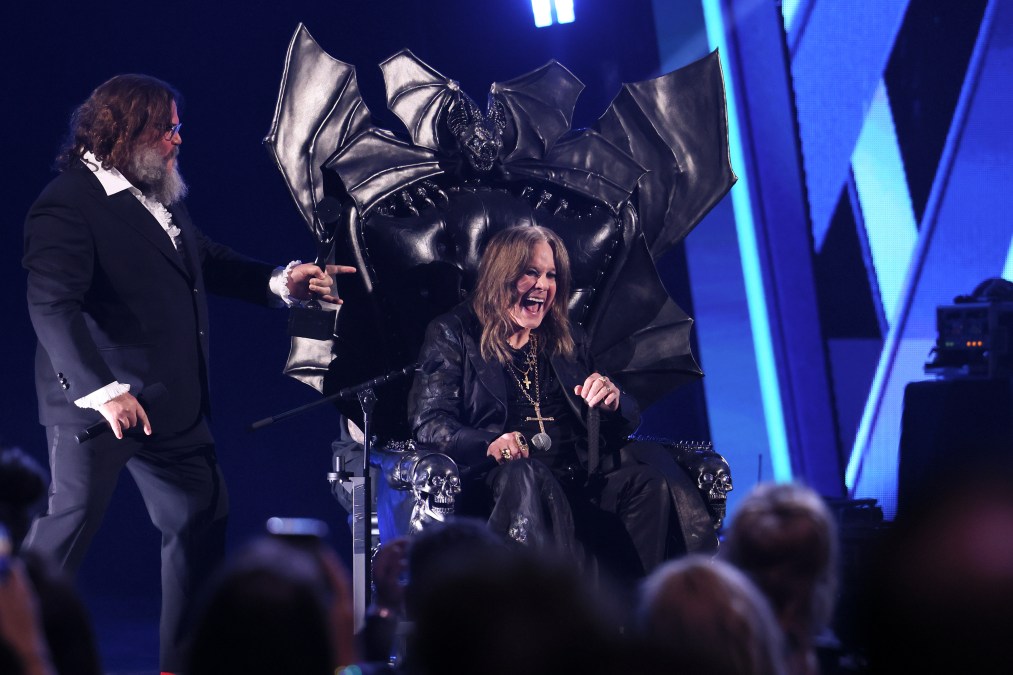 Ozzy Osbourne sitting in a chair