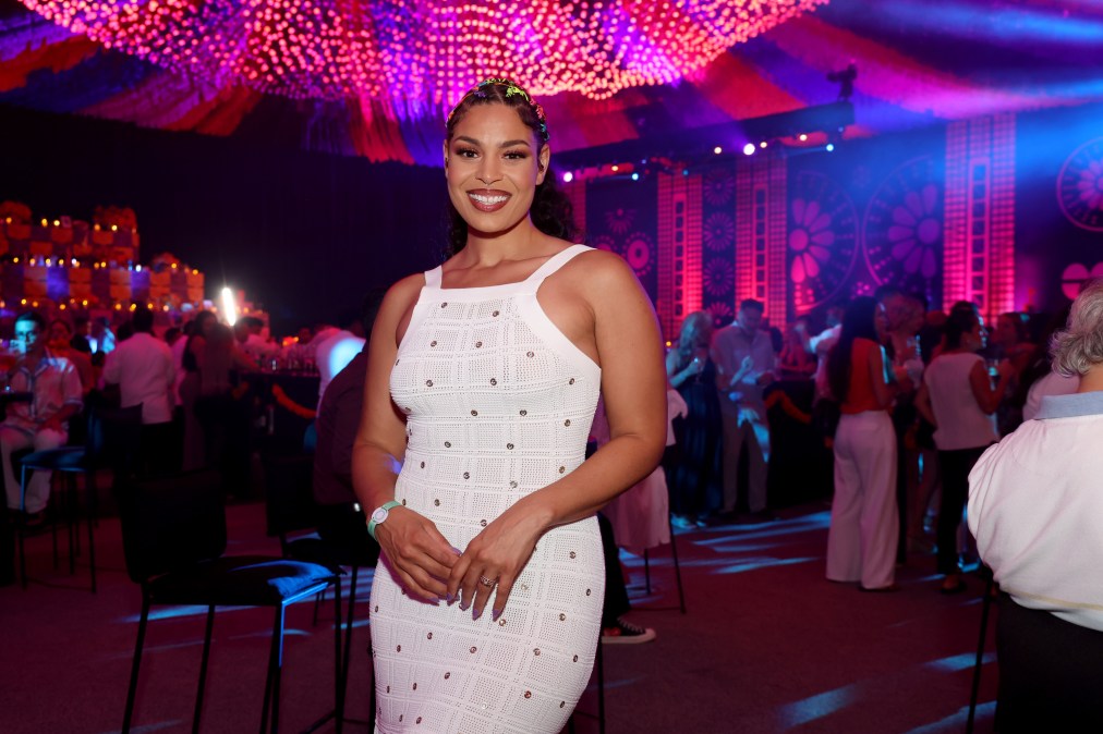 Jordin Sparks posing in a white dress.