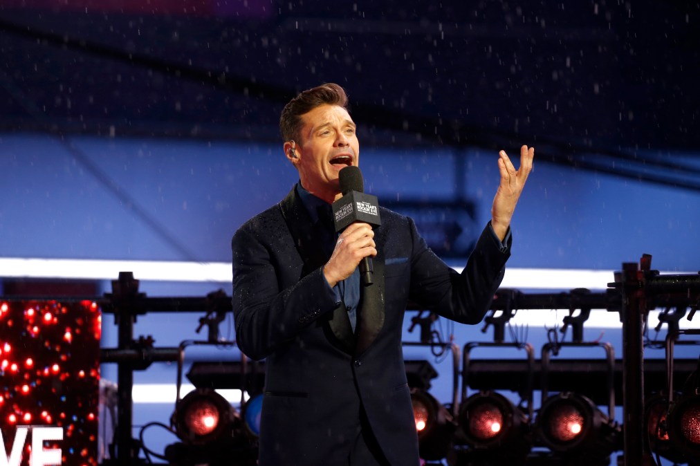 Ryan Seacrest talking into a microphone