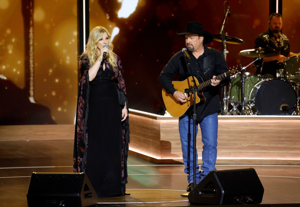 Trisha Yearwood and Garth Brooks performing together.