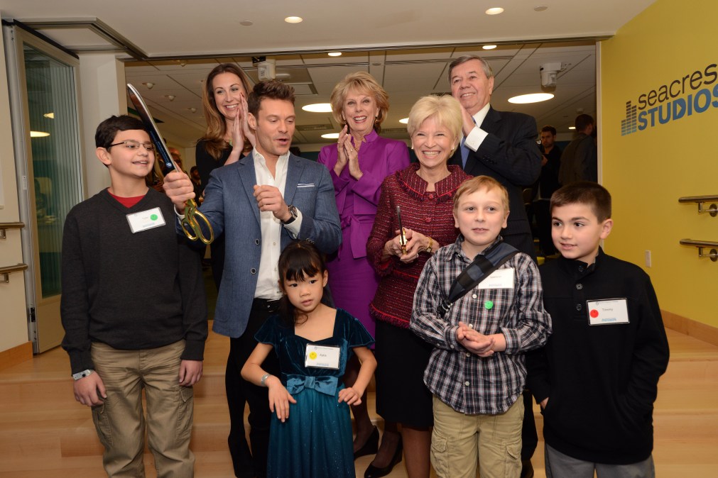 Ryan Seacrest and his family attend the opening of a Seacrest Studio.