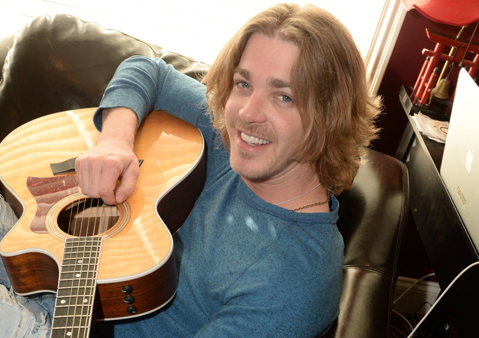Bucky Covington holding a guitar
