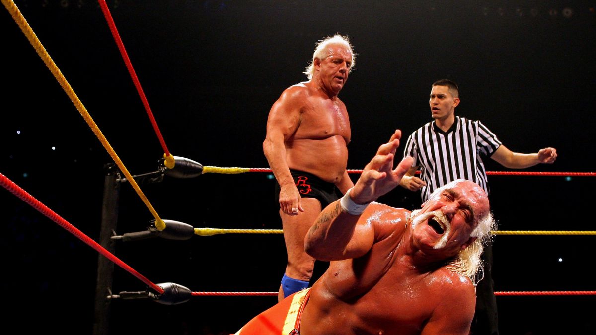 Hulk Hogan grimaces in pain as his opponent Ric Flair stands over him during Hulk Hogan's Hulkamania Tour at Rod Laver Arena on November 21, 2009 in Melbourne, Australia