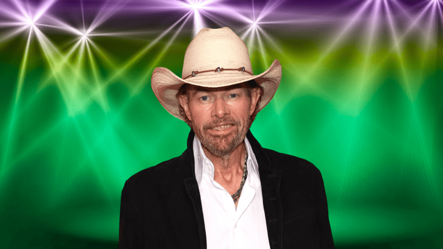 Toby Keith posing on a colorful stage.