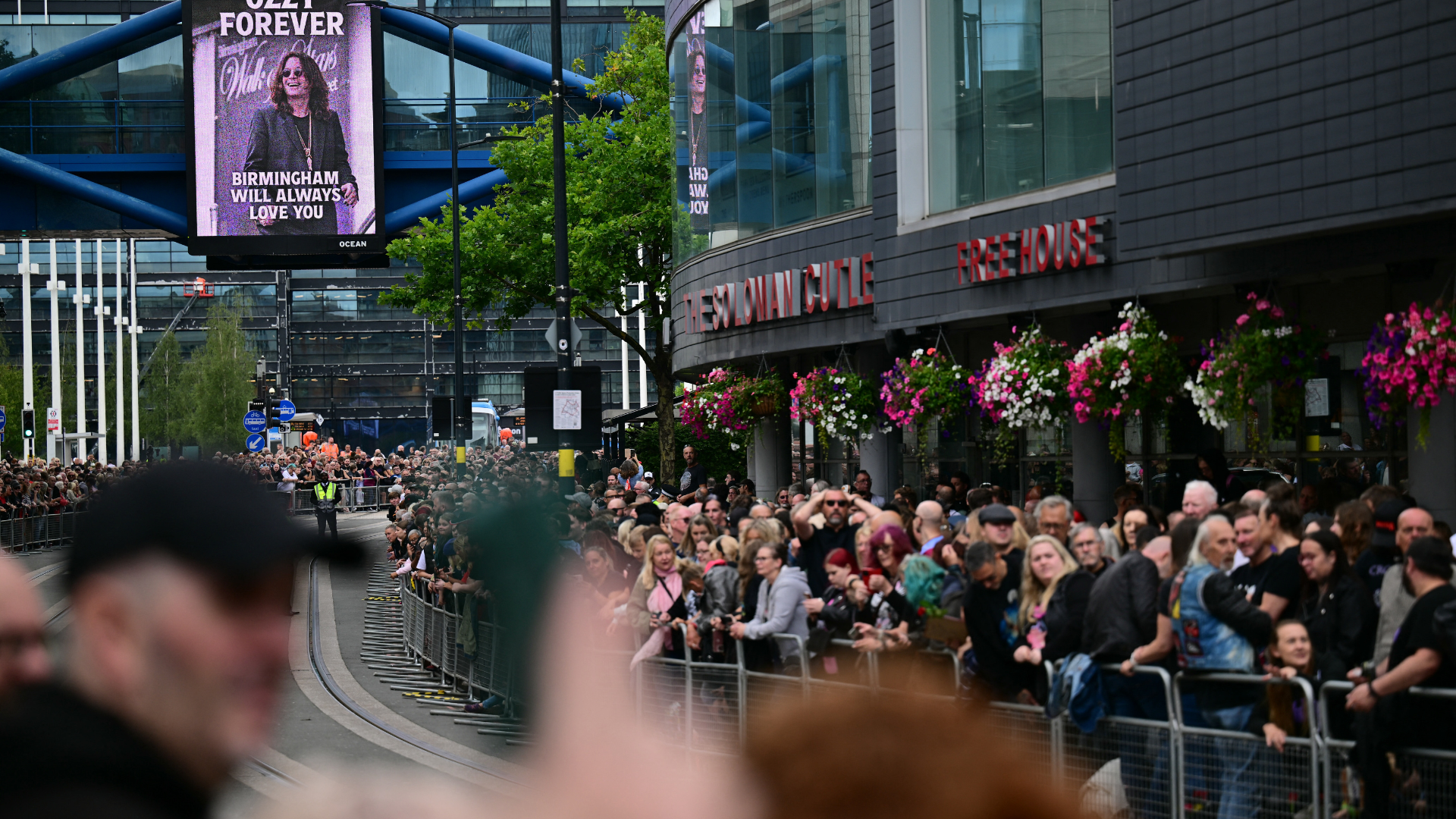 Mourners and music fans line the streets to pay their respects ahead of the funeral cortege of Ozzy Osbourne