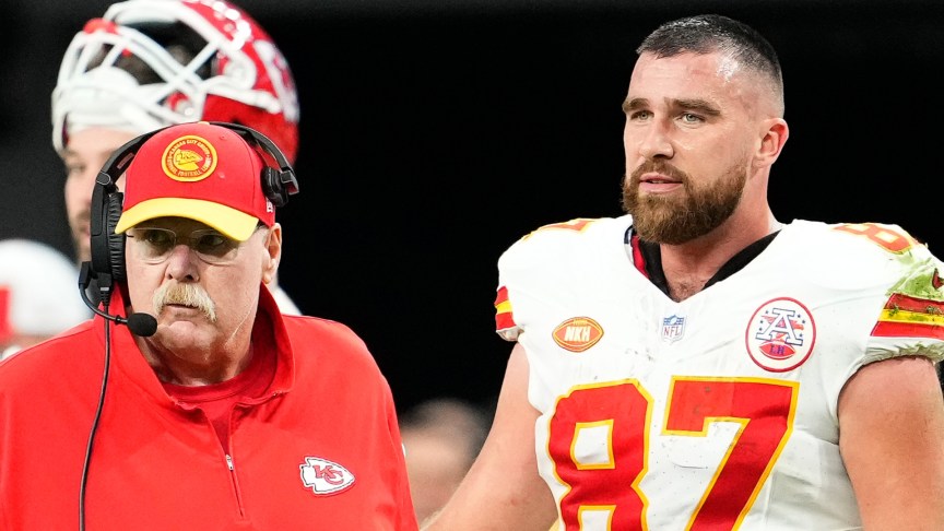 Andy Reid and Travis Kelce on the field during a match
