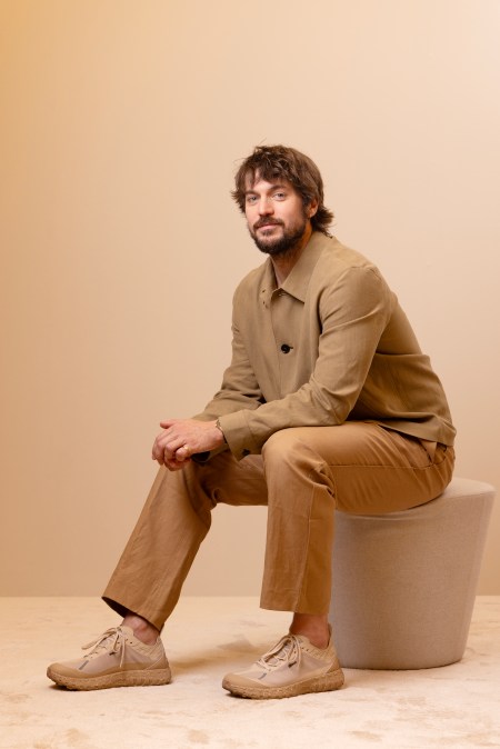 Lucas Bravo poses in the portrait studio during the Red Sea International Film Festival 2023