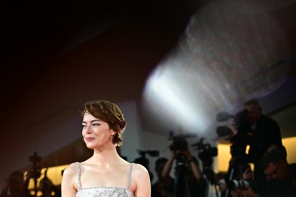 US actress Emma Stone poses on the red carpet before the screening of the movie "Bugonia" presented in competition at the 82nd International Venice Film Festival, at Venice Lido on August 28, 2025.