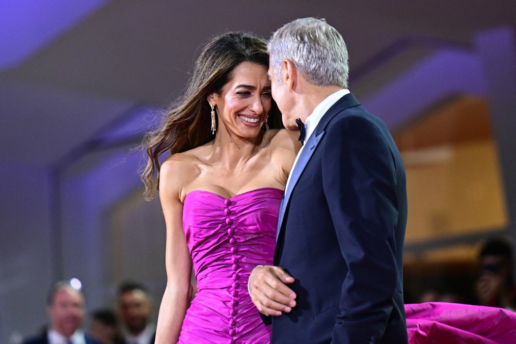 George Clooney and his wife Amal Clooney walk the red carpet 