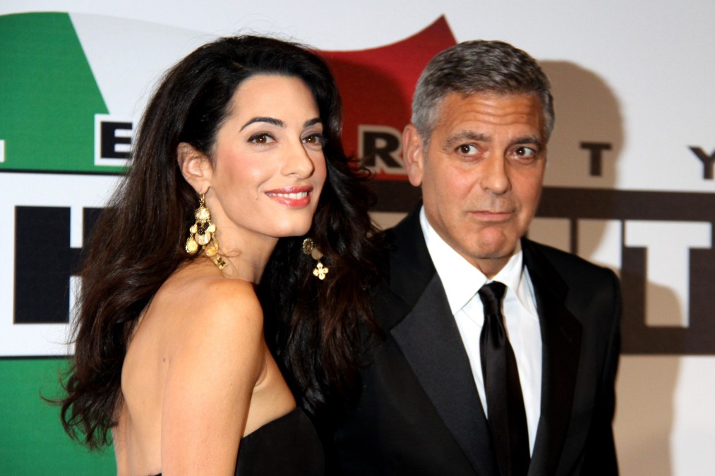 US actor George Clooney arrives with his fiancee Amal Alamuddin 