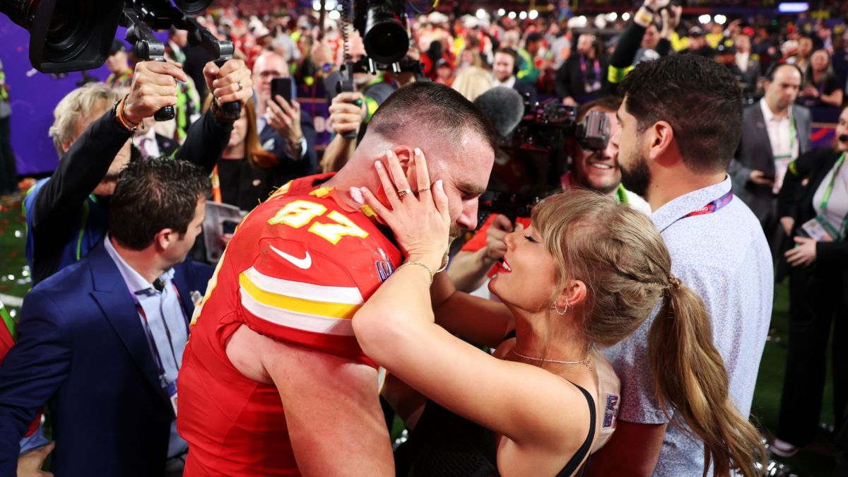 Travis Kelce #87 of the Kansas City Chiefs and Taylor Swift embrace after defeating the San Francisco 49ers 25-22 in overtime during Super Bowl LVIII at Allegiant Stadium on February 11, 2024