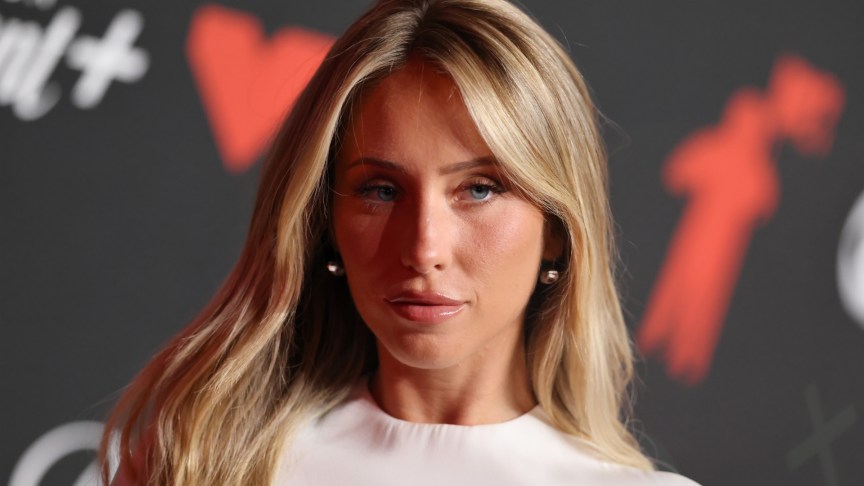 Alix Earle poses for photos at event