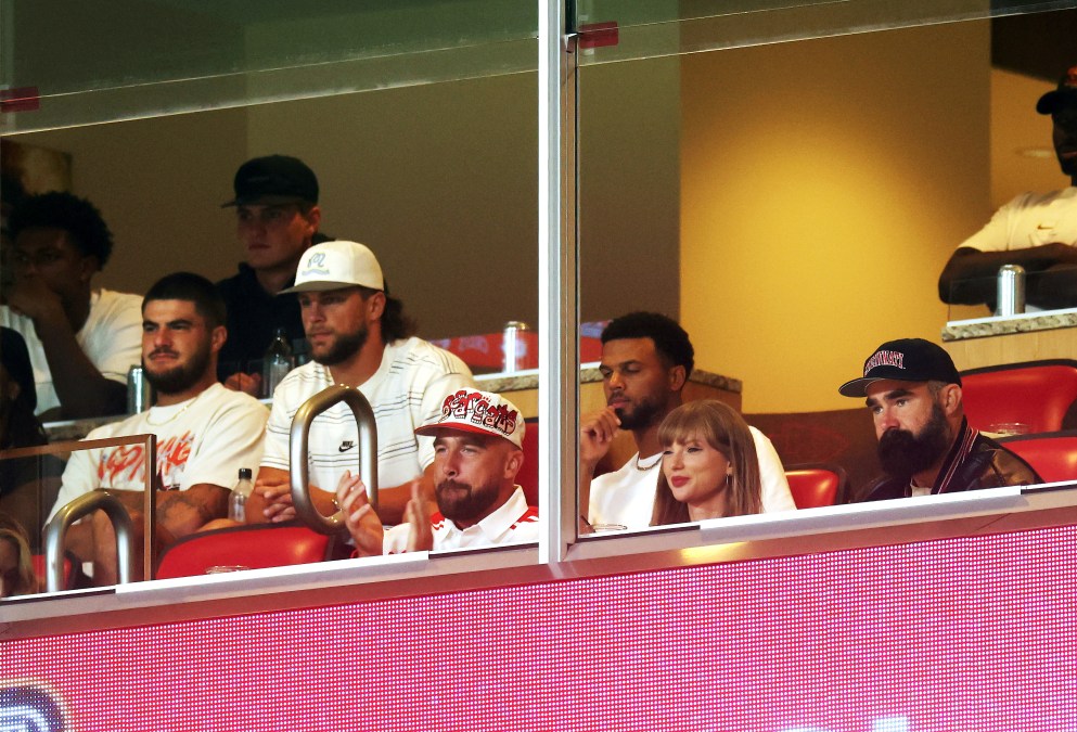 Taylor Swift and Travis Kelce watching an NFL game