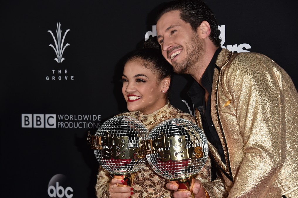 Laurie Hernandez & Val Chmerkovskiy holding mirrorball trophies