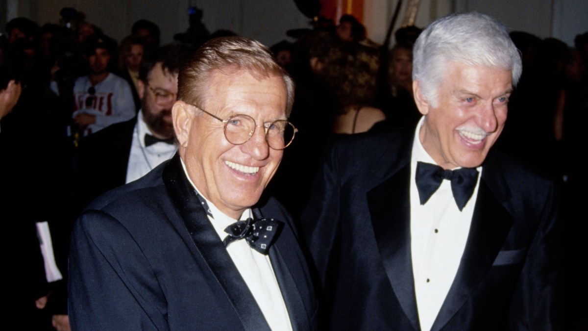 Dick Van Dyke and Jerry Van Dyke smiling while wearing suits