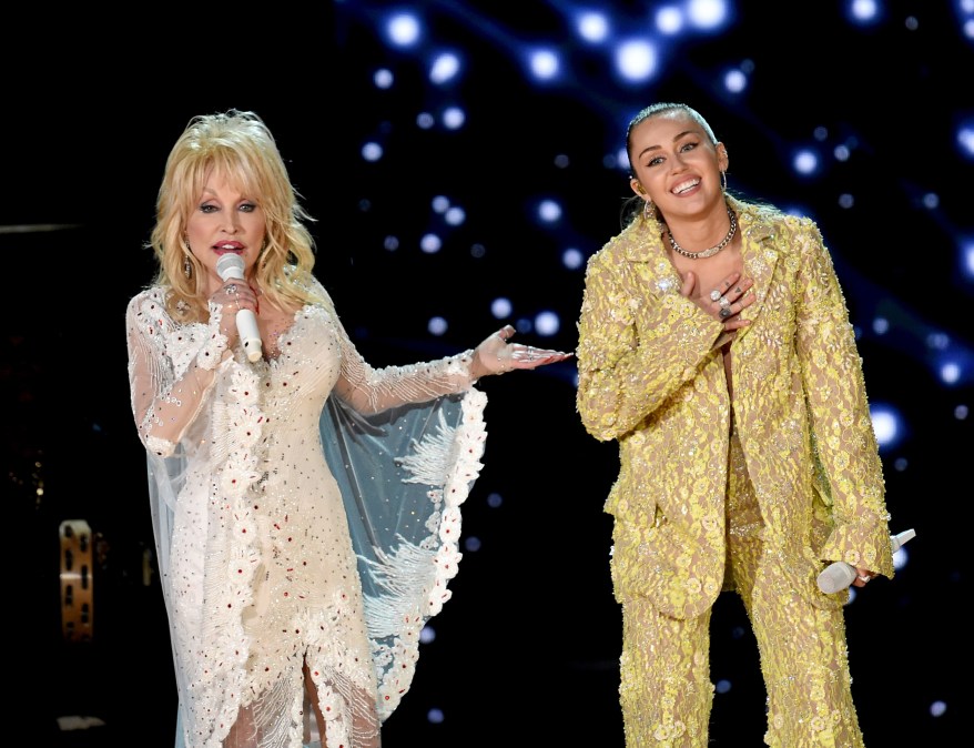 Dolly Parton and Miley Cyrus performing onstage
