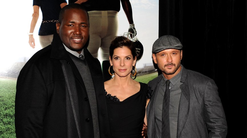 Actor Quinton Aaron, Sandra Bullock and Tim McGraw attend an evnt