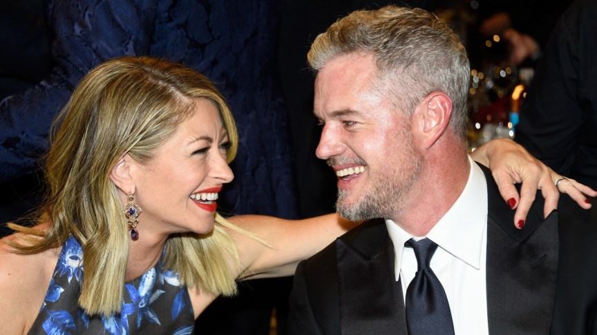 Rebecca Gayheart and Eric Dane smiling at each other