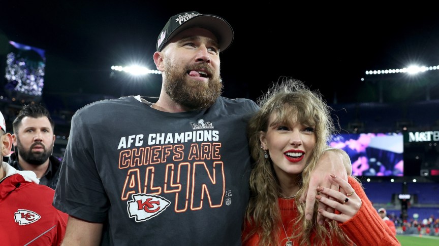 Travis Kelce posing with Taylor Swift